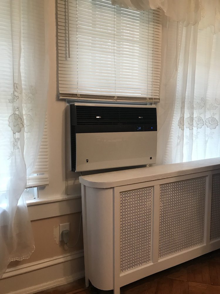Thru-the-wall heating and cooling unit installed inside a home